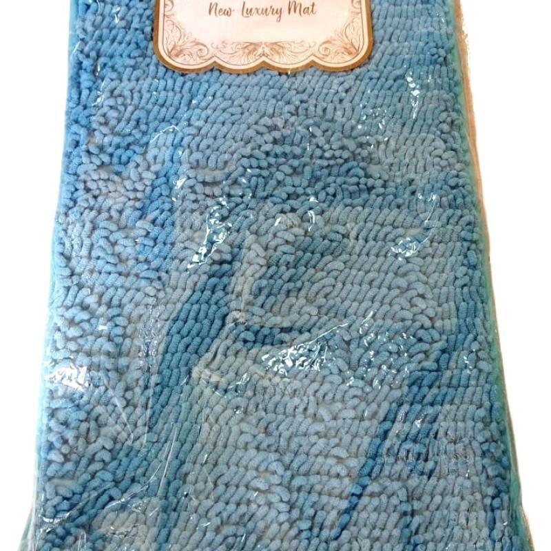 Alfombra azul de baño